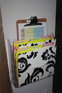 Wall file holder with pretty folders.
